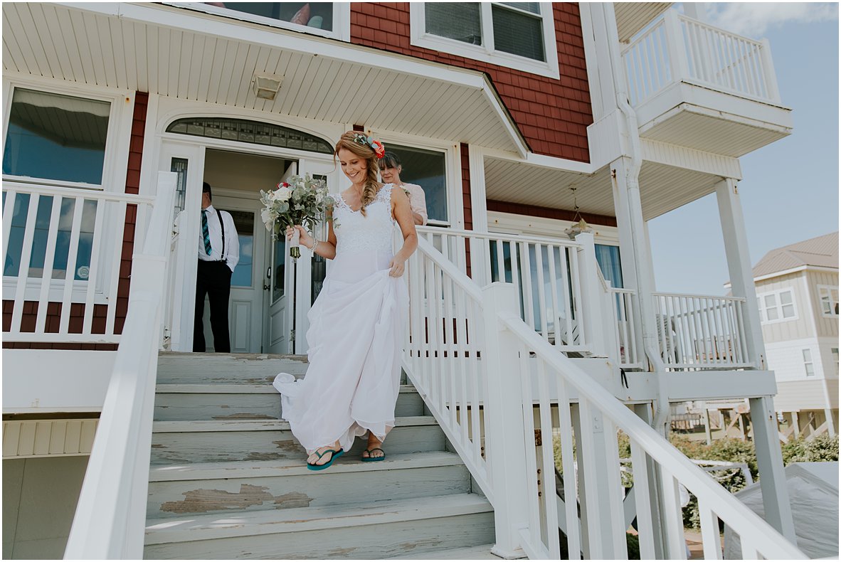 North topsail beach bride walking out of beach rental house for wedding