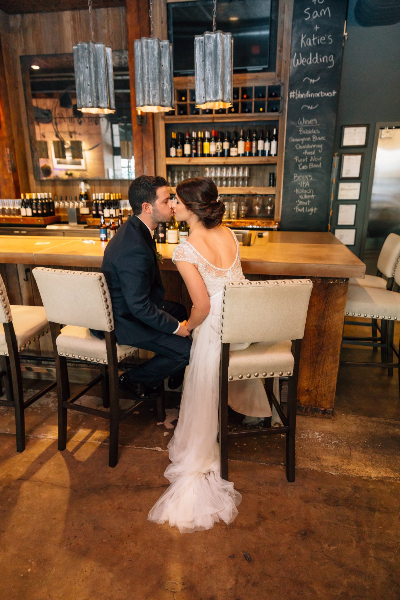 bride and groom kissing at small wedding venue raleigh nc bar