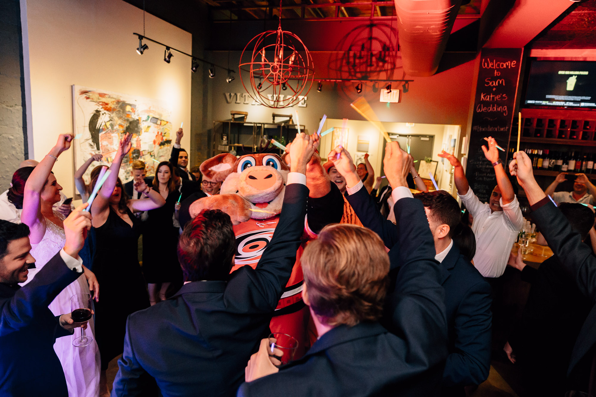 stormy hurricanes mascot makes an appearance at a wedding