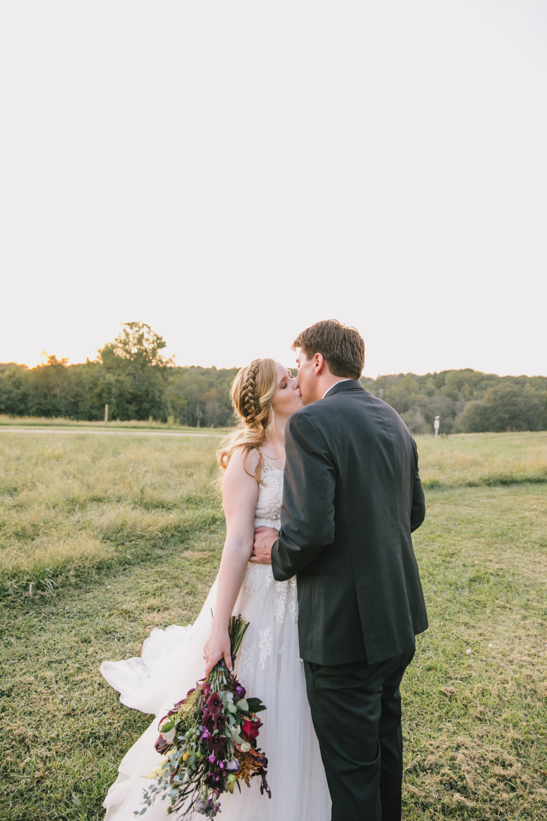 bride & groom kiss at the meadows wedding venue